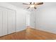 This bedroom includes hardwood floors, a ceiling fan, and a closet with sliding doors at 3615 Sunfish St., Murrells Inlet, SC 29576