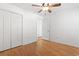 Bright bedroom with neutral walls, wood floors, ceiling fan and double closets for ample storage at 3615 Sunfish St., Murrells Inlet, SC 29576