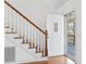 Inviting foyer with wood flooring, a staircase, and an open front door at 3615 Sunfish St., Murrells Inlet, SC 29576