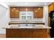 Close-up view of the kitchen island featuring a modern cooktop and a sleek granite countertop at 3615 Sunfish St., Murrells Inlet, SC 29576