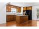 Functional kitchen featuring dark wood cabinets, granite countertops, and a convenient center island at 3615 Sunfish St., Murrells Inlet, SC 29576