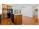 Kitchen with a black refrigerator and oven, wood island, and a door that leads to a porch at 3615 Sunfish St., Murrells Inlet, SC 29576