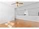 Bright, open living room features hardwood floors and a ceiling fan, creating a comfortable and inviting space at 3615 Sunfish St., Murrells Inlet, SC 29576