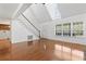 Bright living room with wood floors, stairs, skylight, front door and many windows at 3615 Sunfish St., Murrells Inlet, SC 29576