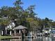 Waterfront with private dock, gazebo, and multiple boats, perfect for waterfront living at 3615 Sunfish St., Murrells Inlet, SC 29576