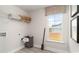 Bright laundry room with storage shelf and a view of the backyard at 362 Glacier Way, Conway, SC 29526