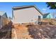 View of the backyard with wood deck and privacy fence on a sunny day at 3816 James Pl., Little River, SC 29566