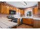 Functional kitchen featuring stainless steel appliances, ample counter space and wood cabinetry at 3816 James Pl., Little River, SC 29566