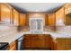 Practical kitchen showcasing ample wood cabinetry and a functional layout at 3816 James Pl., Little River, SC 29566