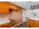 Charming kitchen featuring wooden cabinets and tiled countertops, ready for your culinary creations at 3816 James Pl., Little River, SC 29566