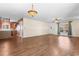 Open-concept living room with hardwood floors seamlessly connecting to the kitchen at 3816 James Pl., Little River, SC 29566