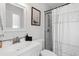 Clean bathroom featuring a shower with glass doors, a white sink, and modern fixtures at 4048 Sandtrap Ave., Little River, SC 29566