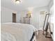 Bright bedroom featuring wood floors, a dresser, and a walk-in bathroom with a mirror at 4048 Sandtrap Ave., Little River, SC 29566