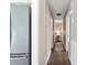 Hallway with hardwood floors, neutral walls, and recessed lighting with artwork hung on the wall at 4048 Sandtrap Ave., Little River, SC 29566