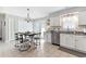 Bright kitchen with stainless steel appliances, white cabinets, and a tiled floor at 4048 Sandtrap Ave., Little River, SC 29566