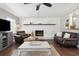 Cozy living room with hardwood floors, a fireplace, and comfortable seating at 4048 Sandtrap Ave., Little River, SC 29566