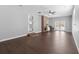 Bright living room with hardwood floors, brick fireplace, and French doors to the outside at 4048 Sandtrap Ave., Little River, SC 29566