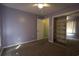 Bedroom with carpeted floors, mirrored closet doors, and a open doorway to another room at 4339 Dew N. Ct., Myrtle Beach, SC 29579