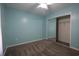 Blue bedroom featuring carpeted floors, a ceiling fan, and a mirrored sliding closet door at 4339 Dew N. Ct., Myrtle Beach, SC 29579