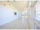 Bright living room with tile floors, high vaulted ceiling, many windows and sliding glass door to the backyard at 4339 Dew N. Ct., Myrtle Beach, SC 29579