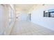 Bright living room with tile floors, high vaulted ceiling, many windows and sliding glass door to the backyard at 4339 Dew N. Ct., Myrtle Beach, SC 29579