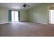 Spacious main bedroom includes a ceiling fan and access to the yard through French doors at 4339 Dew N. Ct., Myrtle Beach, SC 29579