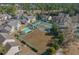 The aerial view displays a community with tennis courts and a swimming pool, surrounded by residences at 4494 Little River Inn Ln. # 2301, Little River, SC 29566