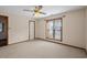 Neutral bedroom with carpet, window and a ceiling fan at 4494 Little River Inn Ln. # 2301, Little River, SC 29566