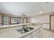 Kitchen with stainless steel sink and breakfast bar overlooking the living area at 4494 Little River Inn Ln. # 2301, Little River, SC 29566