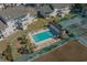 Aerial view of community pool with lounge chairs, palm trees, and surrounding condos at 4494 Little River Inn Ln. # 2301, Little River, SC 29566