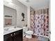 Bathroom featuring floral shower curtain, tile floors, and decor at 5027 Prato Loop, Myrtle Beach, SC 29579