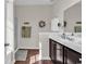 Bright bathroom featuring dark cabinets, white countertops, and walk-in shower at 5027 Prato Loop, Myrtle Beach, SC 29579