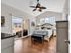 Vaulted ceiling primary bedroom featuring sliding glass doors and wood flooring at 5027 Prato Loop, Myrtle Beach, SC 29579