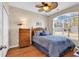 Bedroom featuring a ceiling fan, window, and wooden furniture at 5027 Prato Loop, Myrtle Beach, SC 29579