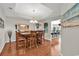 Dining room with hardwood floors and elegant lighting fixtures at 5027 Prato Loop, Myrtle Beach, SC 29579