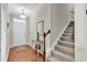 Welcoming foyer featuring hardwood floors, a staircase, and a charming decor at 5027 Prato Loop, Myrtle Beach, SC 29579