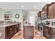 Kitchen with stainless steel appliances, dark cabinets, and granite countertops at 5027 Prato Loop, Myrtle Beach, SC 29579