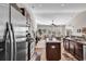 Spacious kitchen with stainless steel appliances flowing into the bright living space at 5027 Prato Loop, Myrtle Beach, SC 29579