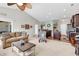 Open-concept living room with vaulted ceiling and a seamless flow into the kitchen at 5027 Prato Loop, Myrtle Beach, SC 29579