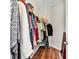 Walk-in closet with wood floors, wire shelving, and hanging clothes at 5027 Prato Loop, Myrtle Beach, SC 29579