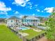 Aerial view showing the two homes, manicured lawns, in-ground pools and shared fence lines at 518 Harbour View Dr., Myrtle Beach, SC 29579