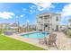 Expansive backyard boasts a private pool, patio with seating, and lush lawn for outdoor enjoyment at 518 Harbour View Dr., Myrtle Beach, SC 29579