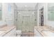 Bathroom featuring a glass shower enclosure, double vanity with marble countertop, and modern fixtures at 518 Harbour View Dr., Myrtle Beach, SC 29579