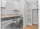 Well-organized laundry room with new appliances and shelving at 518 Harbour View Dr., Myrtle Beach, SC 29579