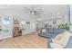 Spacious living room with modern furnishings, wood floors, and a seamless view into the kitchen at 518 Harbour View Dr., Myrtle Beach, SC 29579