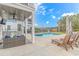 This pool is surrounded by lounge chairs and shaded seating, perfect for relaxing and entertaining guests at 518 Harbour View Dr., Myrtle Beach, SC 29579