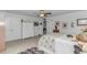 Bright bedroom featuring a plush bed with white comforter, closet, and white dresser at 560 Pier Ct., Longs, SC 29568