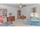 Bright bedroom featuring neutral flooring, shelving units, dresser and plush seating at 560 Pier Ct., Longs, SC 29568