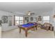 Bright Game room featuring a pool table with plush seating, neutral carpet, and multiple wall decorations at 560 Pier Ct., Longs, SC 29568