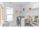 Clean laundry room featuring a washer, dryer, shelving, and a window at 560 Pier Ct., Longs, SC 29568